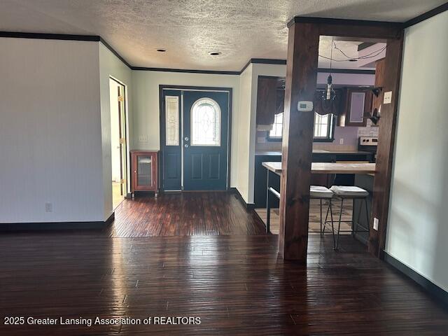 464 N Rolland Rd, Weidman, MI 48893 - foyer entrance with a wealth of natural light, wood finished floors, ornamental molding, and a textured ceiling