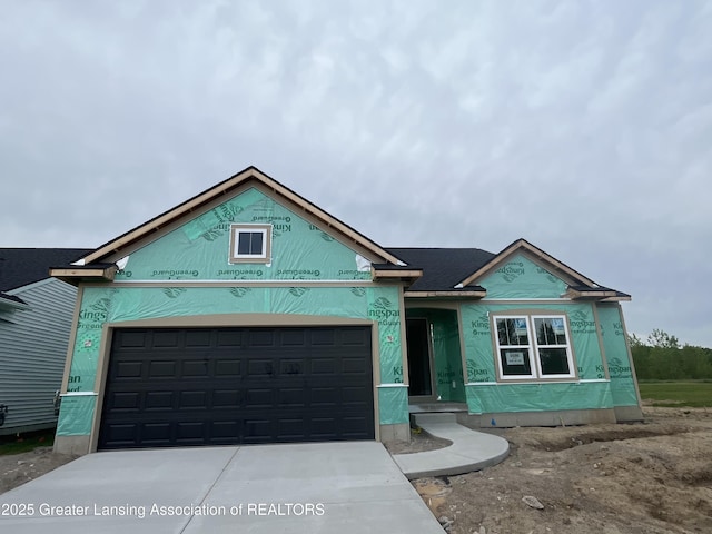 6686 Castleton Dr, Grand Ledge, MI 48837 - property under construction with driveway and an attached garage
