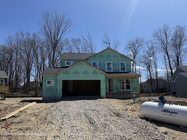 property under construction with driveway and a garage