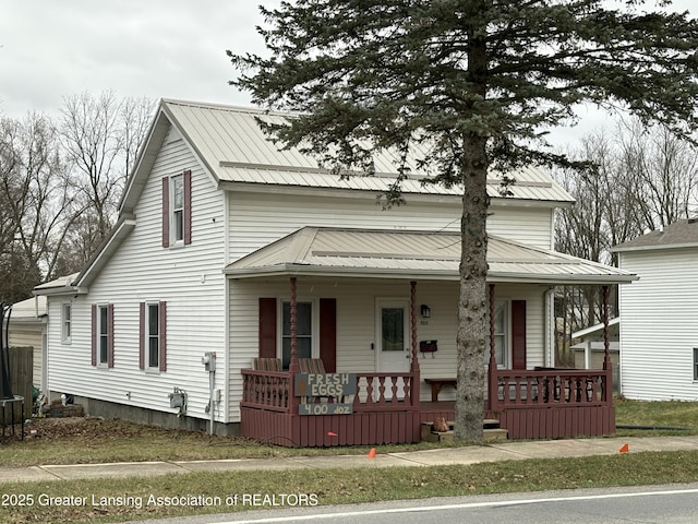 view of front of house with metal roof and a porch