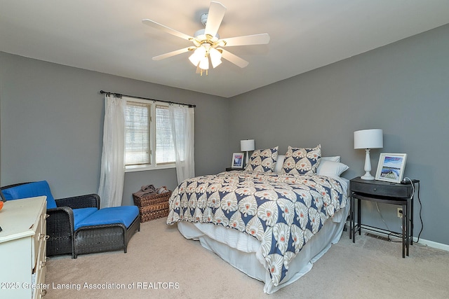 carpeted bedroom with baseboards and ceiling fan