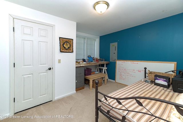 bedroom with light colored carpet, electric panel, and baseboards