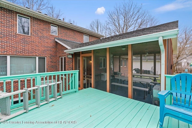 wooden terrace with a sunroom