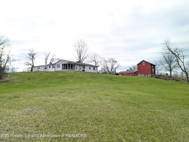 12302 Sandborn Rd, Portland, MI 48875 - view of yard featuring a barn and an outbuilding