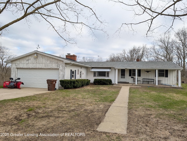 12302 Sandborn Rd, Portland, MI 48875 - ranch-style home featuring covered porch, board and batten siding, a chimney, a front yard, and a garage