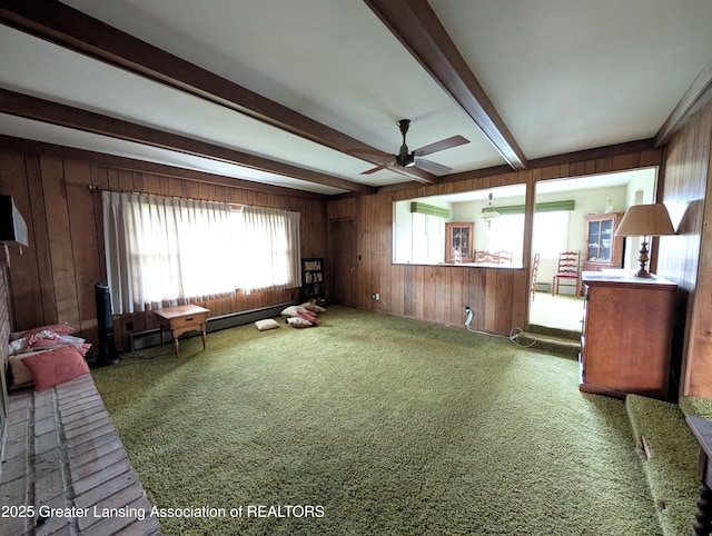 12302 Sandborn Rd, Portland, MI 48875 - living room featuring carpet floors, a ceiling fan, wood walls, and beam ceiling