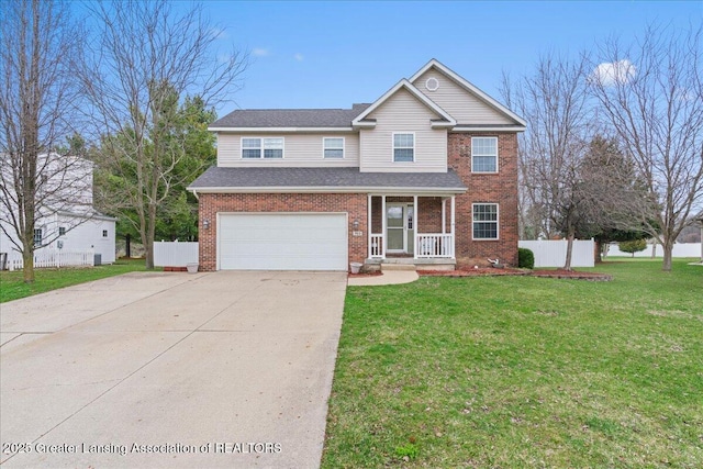 traditional-style home featuring a front lawn, fence, brick siding, and a garage
