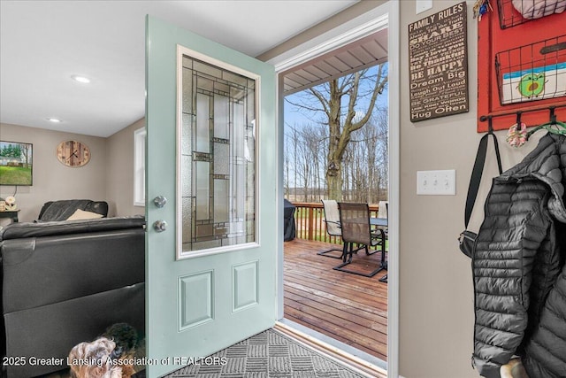 doorway to outside with wood finished floors and recessed lighting