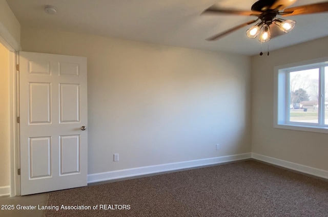 2491 W Price Rd, Saint Johns, MI 48879 - empty room with baseboards, dark carpet, and a ceiling fan