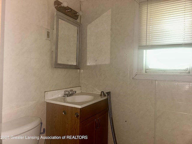 3429 Lowcroft Ave, Lansing, MI 48910 - bathroom with tile walls and vanity