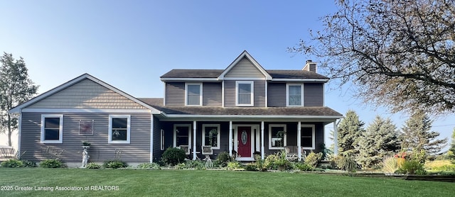 view of front of home featuring a porch, a front yard, roof with shingles, and a chimney
