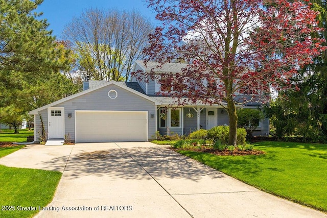 traditional home with a front yard, driveway, a chimney, and a garage