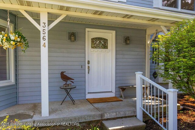 doorway to property with a porch