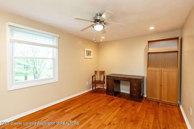 interior space with light wood-style flooring, baseboards, a ceiling fan, and recessed lighting