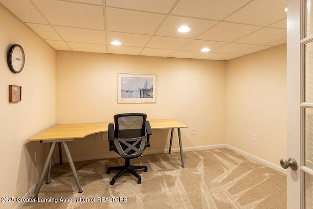 office space featuring a paneled ceiling, carpet flooring, baseboards, and recessed lighting