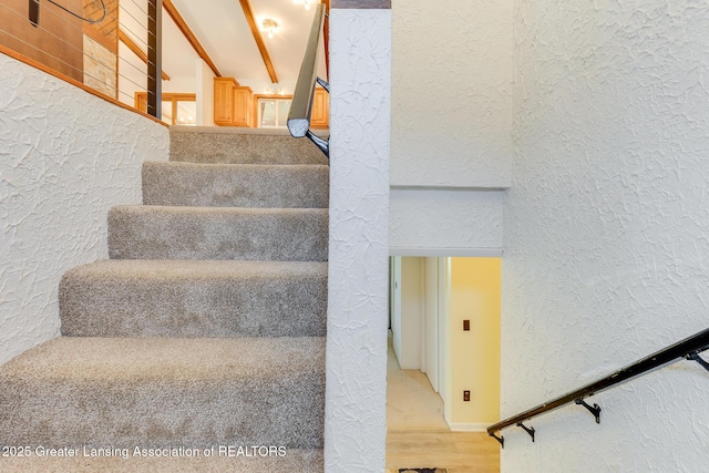9605 Jason Rd, Laingsburg, MI 48848 - stairway featuring a textured wall and wood finished floors