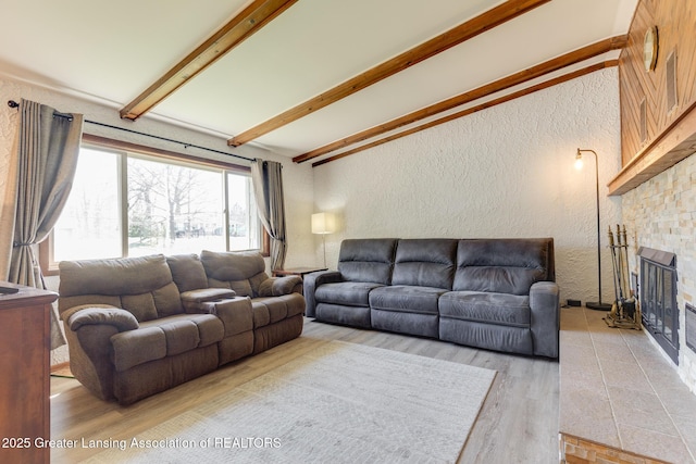 9605 Jason Rd, Laingsburg, MI 48848 - living room featuring a textured wall, wood finished floors, and lofted ceiling with beams