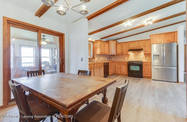 9605 Jason Rd, Laingsburg, MI 48848 - dining space with a notable chandelier, vaulted ceiling with beams, and light wood-type flooring
