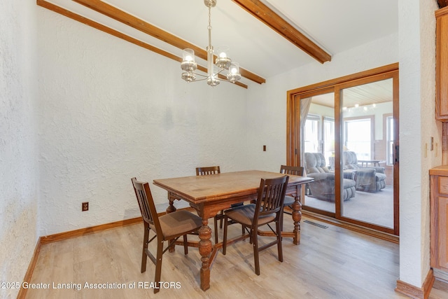 9605 Jason Rd, Laingsburg, MI 48848 - dining room featuring light wood-style flooring, vaulted ceiling with beams, visible vents, a chandelier, and a textured wall