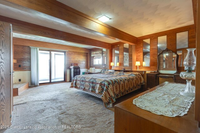 9605 Jason Rd, Laingsburg, MI 48848 - bedroom featuring multiple windows, carpet floors, access to outside, and wood walls