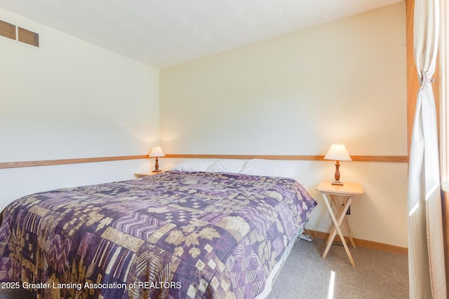 9605 Jason Rd, Laingsburg, MI 48848 - bedroom featuring baseboards, visible vents, and carpet