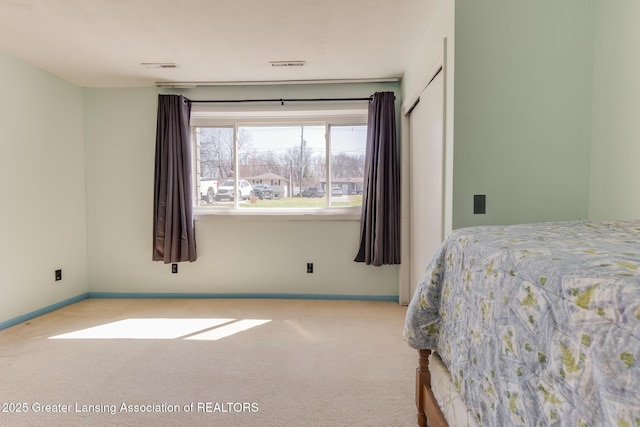 9605 Jason Rd, Laingsburg, MI 48848 - bedroom featuring carpet floors, visible vents, and baseboards