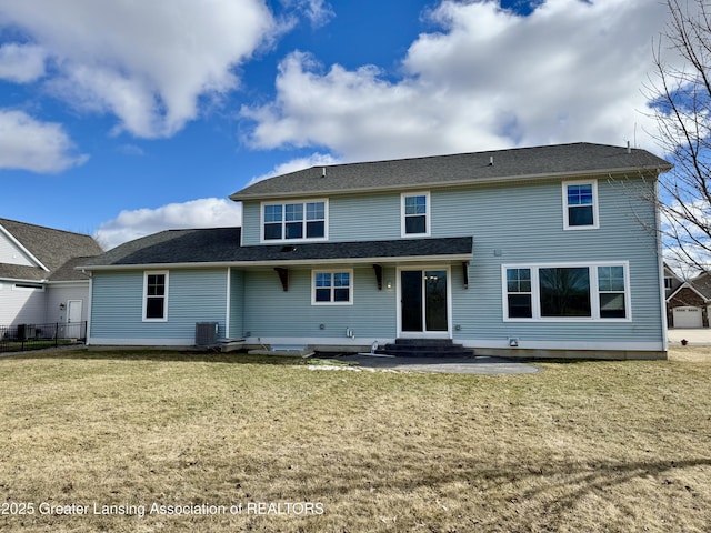 2632 Carnoustie Dr, Okemos, MI 48864 - rear view of property with a yard, entry steps, and central AC