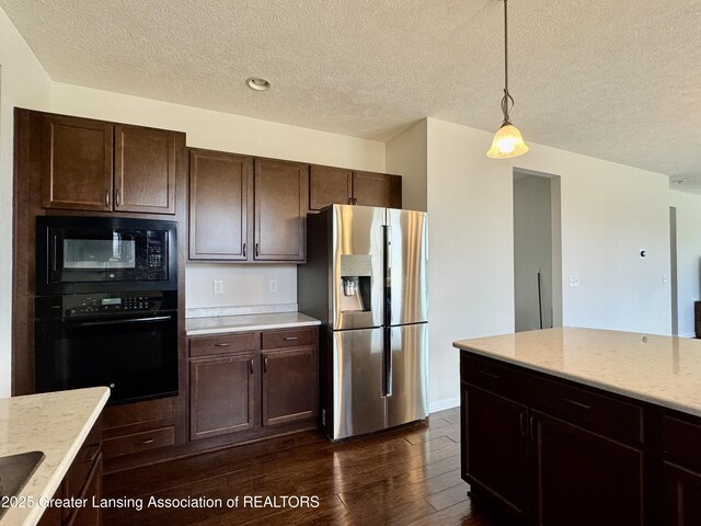 2632 Carnoustie Dr, Okemos, MI 48864 - kitchen featuring dark brown cabinetry, dark wood-style floors, a textured ceiling, and black appliances
