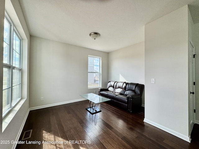 2632 Carnoustie Dr, Okemos, MI 48864 - living room featuring visible vents, a wealth of natural light, wood finished floors, and baseboards