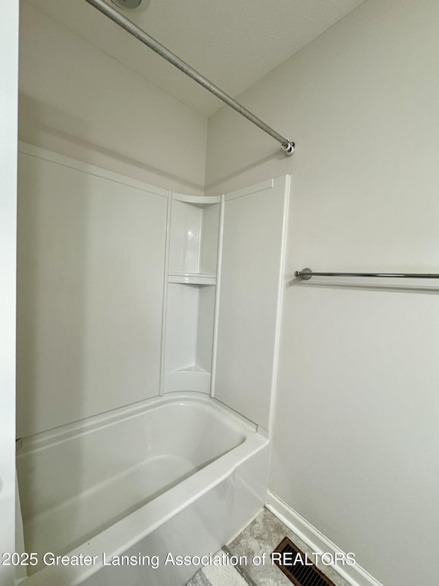 2632 Carnoustie Dr, Okemos, MI 48864 - bathroom featuring washtub / shower combination and baseboards