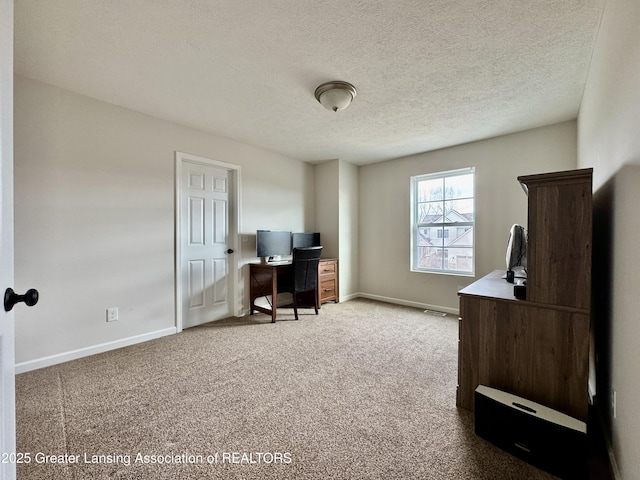 2632 Carnoustie Dr, Okemos, MI 48864 - office with a textured ceiling, baseboards, and carpet floors