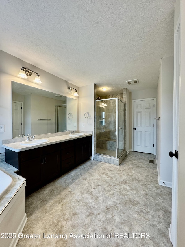 2632 Carnoustie Dr, Okemos, MI 48864 - bathroom with a textured ceiling, a sink, and visible vents