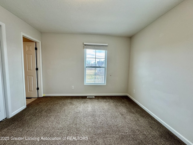 2632 Carnoustie Dr, Okemos, MI 48864 - carpeted spare room with visible vents and baseboards