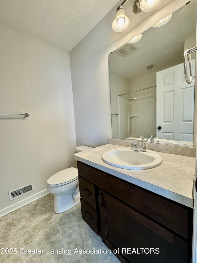 2632 Carnoustie Dr, Okemos, MI 48864 - full bathroom with visible vents, toilet, a shower, a textured ceiling, and vanity