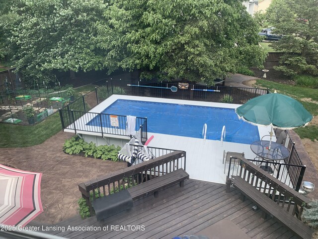 1970 Hollowbrook Dr, Holt, MI 48842 - view of pool with fence, a fenced in pool, stairs, and a deck