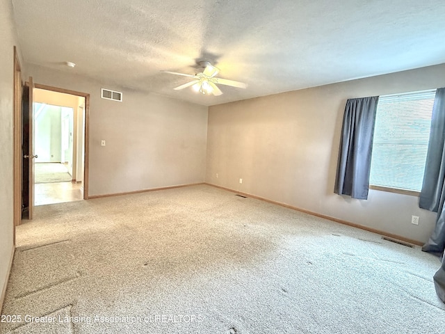 1970 Hollowbrook Dr, Holt, MI 48842 - empty room featuring baseboards, ceiling fan, carpet flooring, and visible vents