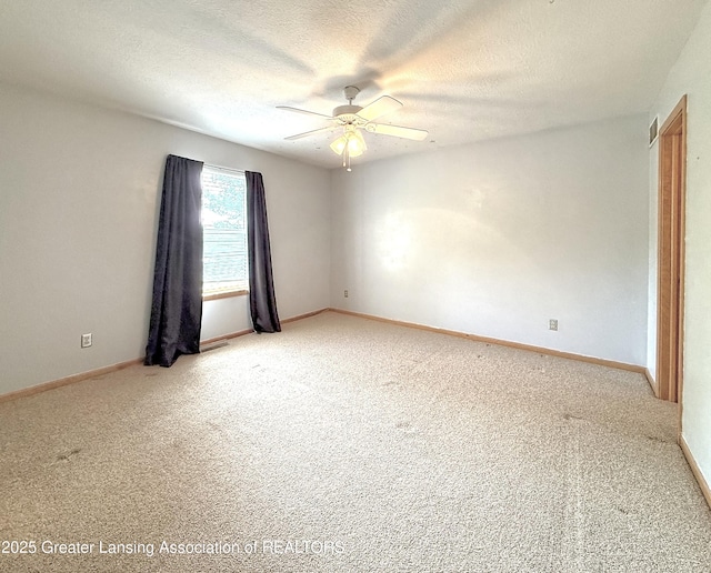 1970 Hollowbrook Dr, Holt, MI 48842 - empty room featuring light colored carpet, baseboards, ceiling fan, and visible vents
