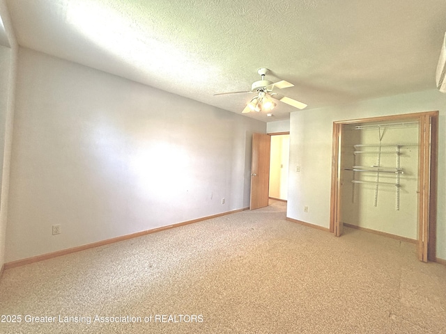 1970 Hollowbrook Dr, Holt, MI 48842 - unfurnished bedroom with light colored carpet, a textured ceiling, a ceiling fan, baseboards, and a closet