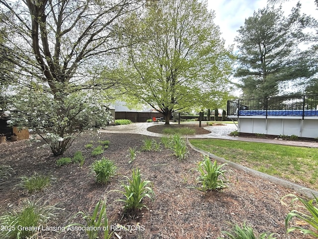 1970 Hollowbrook Dr, Holt, MI 48842 - view of yard featuring fence and an outdoor pool