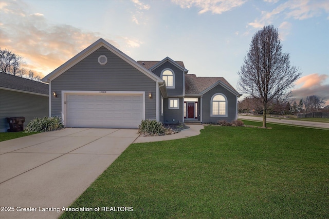 14178 Mulholland Dr, Bath, MI 48808 - traditional-style house featuring an attached garage, a lawn, and concrete driveway