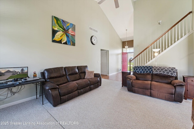 14178 Mulholland Dr, Bath, MI 48808 - living area featuring baseboards, carpet, visible vents, and high vaulted ceiling