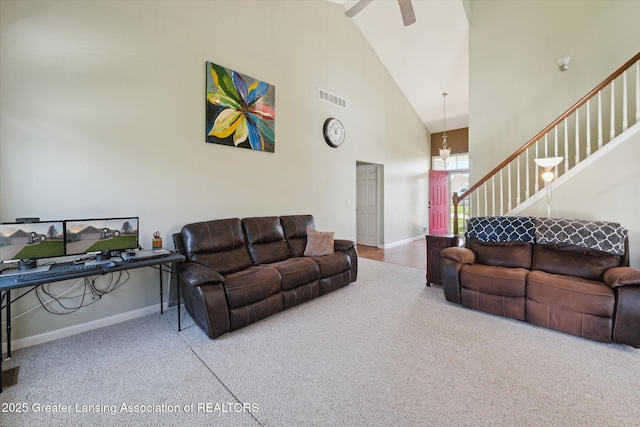 14178 Mulholland Dr, Bath, MI 48808 - living room with high vaulted ceiling, a ceiling fan, carpet floors, baseboards, and visible vents