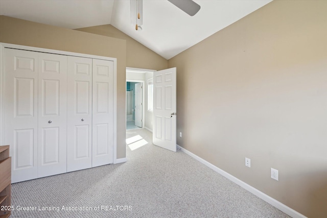 14178 Mulholland Dr, Bath, MI 48808 - unfurnished bedroom with baseboards, lofted ceiling, a closet, ceiling fan, and carpet floors