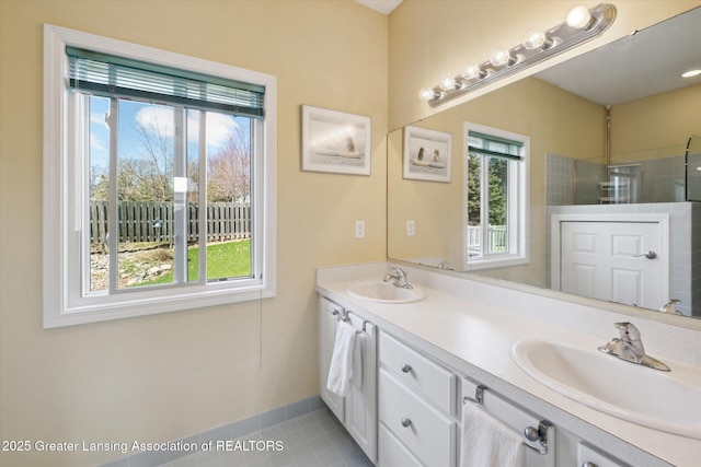 14178 Mulholland Dr, Bath, MI 48808 - bathroom with baseboards, tile patterned floors, a sink, and tiled shower