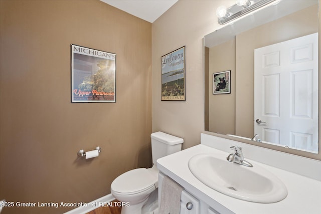 14178 Mulholland Dr, Bath, MI 48808 - half bathroom with baseboards, vanity, and toilet