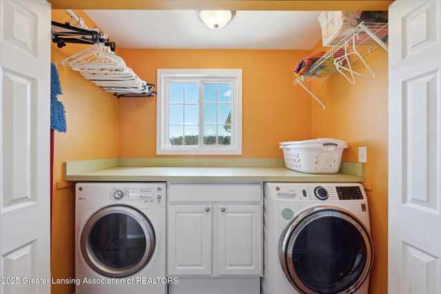 14178 Mulholland Dr, Bath, MI 48808 - laundry area featuring washer / dryer and cabinet space