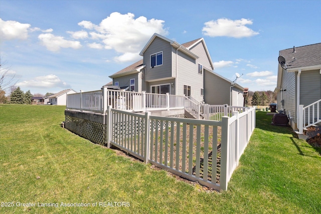 14178 Mulholland Dr, Bath, MI 48808 - back of property with a wooden deck and a yard
