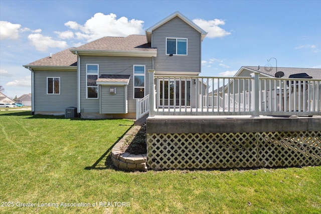 14178 Mulholland Dr, Bath, MI 48808 - back of property featuring central air condition unit, a lawn, a shingled roof, and a deck