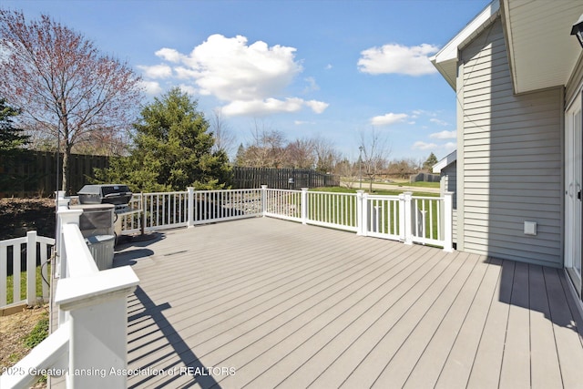 14178 Mulholland Dr, Bath, MI 48808 - wooden terrace with fence and a grill