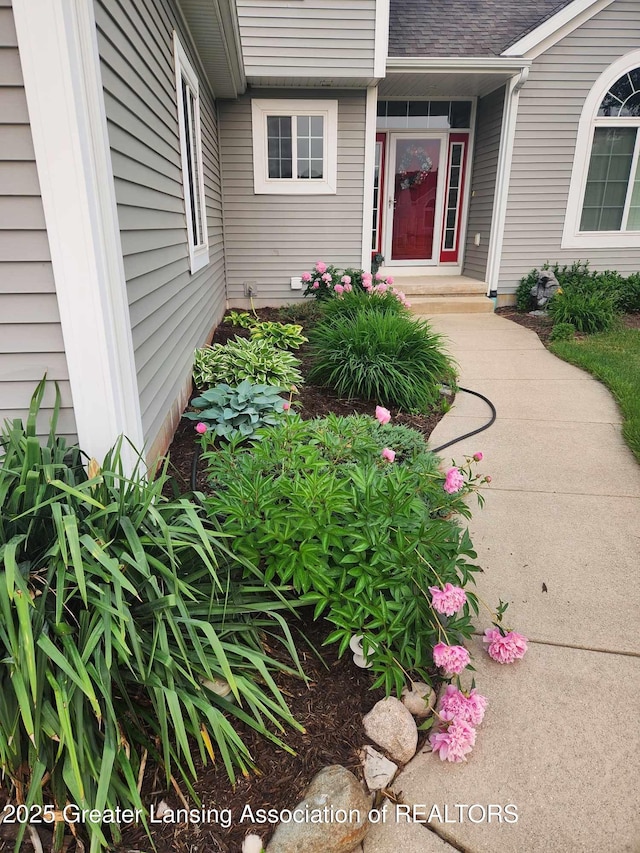 14178 Mulholland Dr, Bath, MI 48808 - property entrance featuring roof with shingles